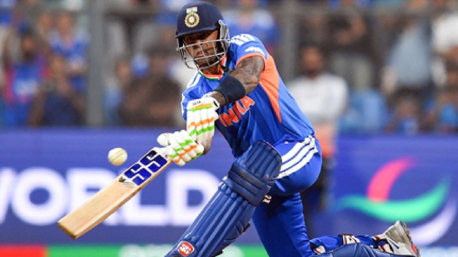 Suryakumar Yadav pointing to the India badge